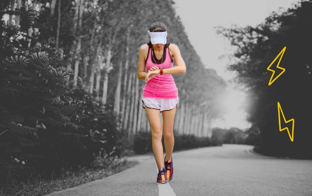 Runner checking fitness tracker during Zone 2 training session
