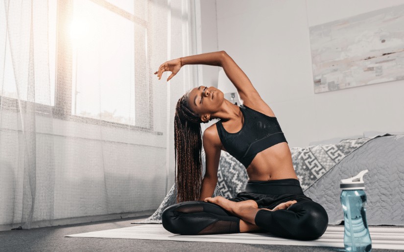 Person doing bodyweight exercises at home for fitness without gym equipment